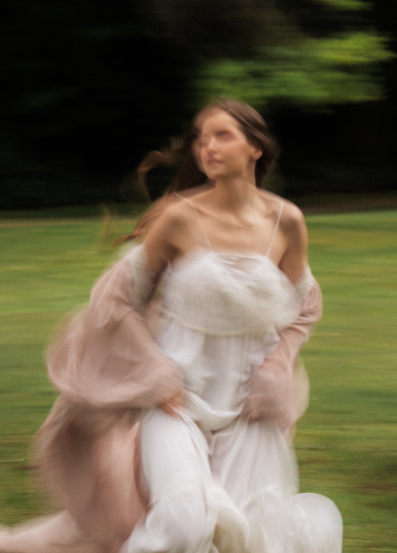 Woman moving through a garden